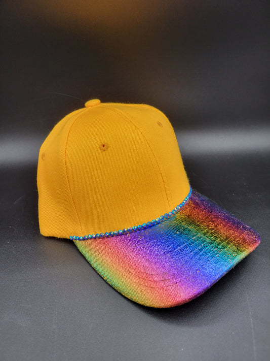Golden dad cap with rainbow foil and blue rhinestones